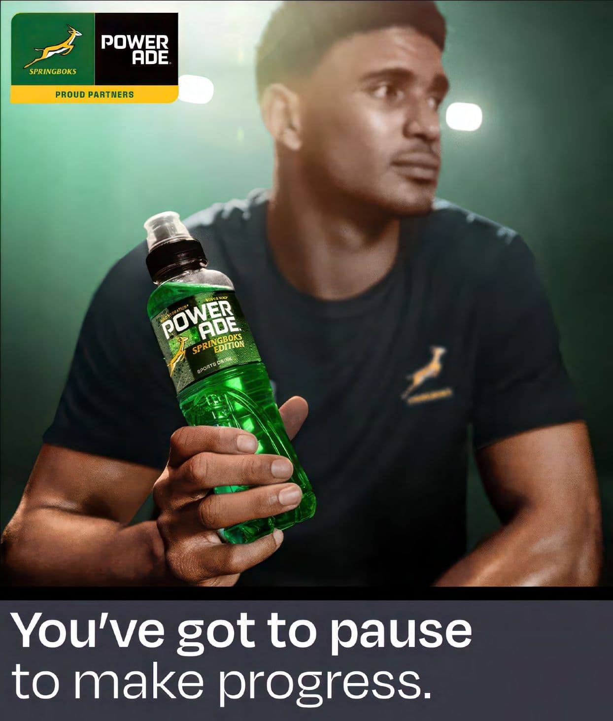 Man holding green Powerade Springboks bottle with slogan: You've got to pause to make progress.